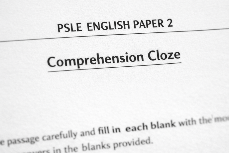 Close-up of PSLE English Paper 2 showing the Comprehension Cloze section.